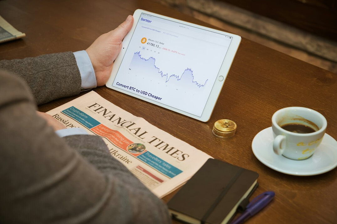 person studying investment charts