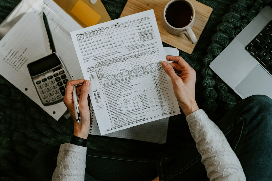 person calculating savings