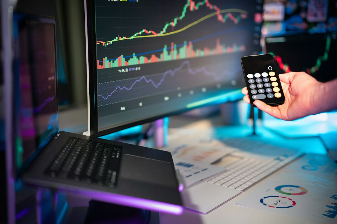 person analyzing stock charts