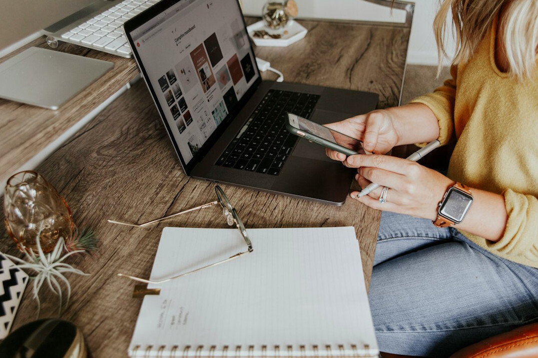 woman tracking expenses on laptop